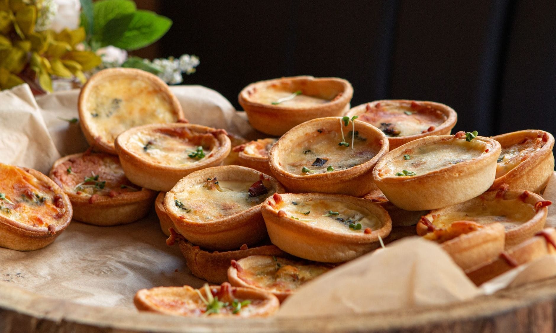 Golden mini quiches on kraft paper